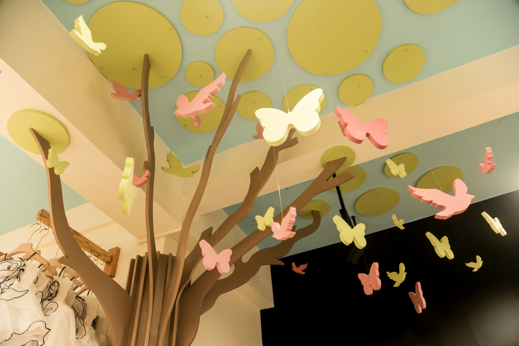 Whimsical bird installation suspended inside Amie's Studios