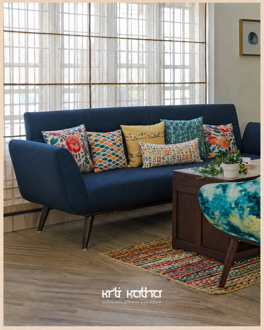 Blue sofa with colorful cushions set against floor-to-ceiling woven window shades