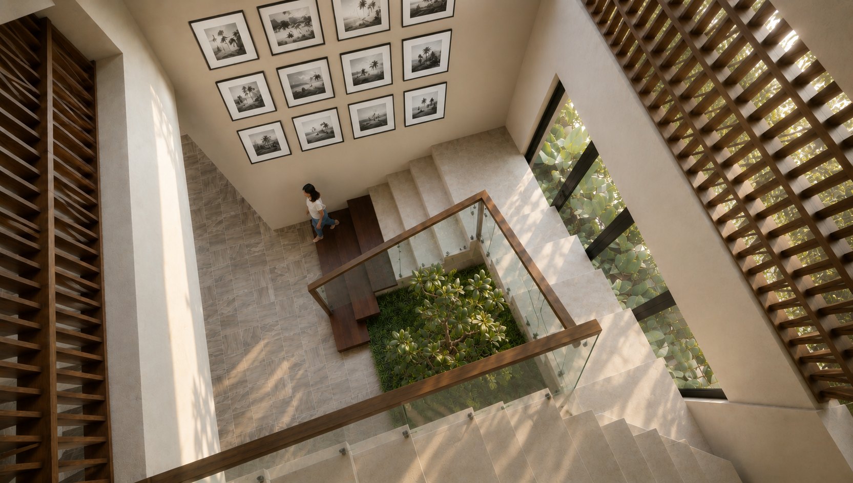 Double-height stair court at The Arched Home beneath a gallery of framed artwork