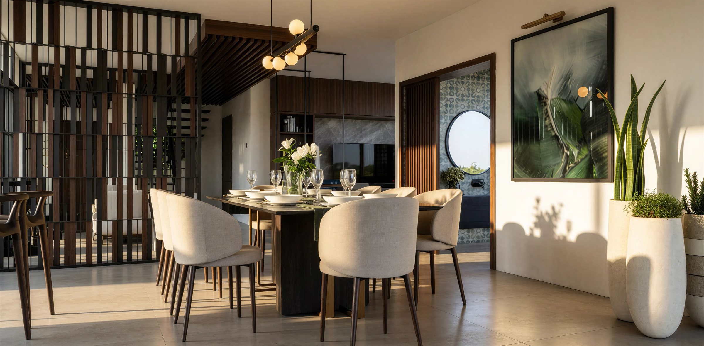 Dining room with cream chairs, botanical art and a backlit geometric wood partition
